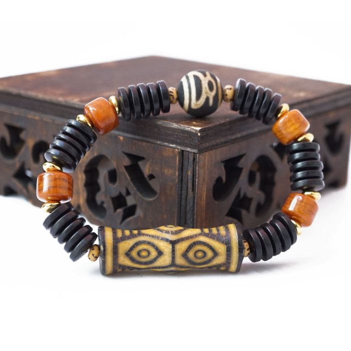 Браслет Дзі фігурна "6 очей" із кокосу