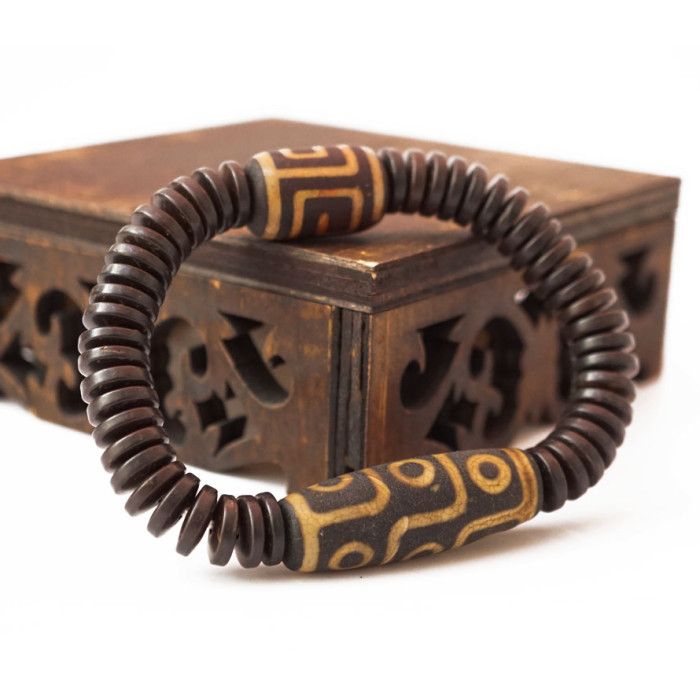 Браслет Дзі "9 очей" з кокосу