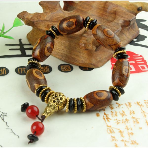 Браслет шість коричневих триоких ДЗІ з китицею